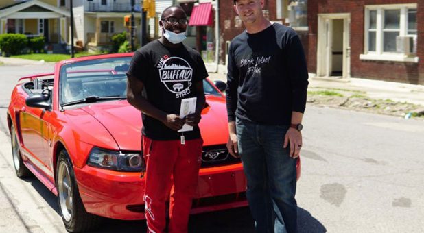 Antonio Gwynn Jr. (left) received a 2004 Mustang from Matt Block as a reward for Gwynn’s work cleaning up after protests